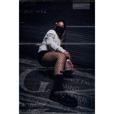 Low Angle Female Model wearing Ghostn White Die Trying Long Sleeve Shirt side view